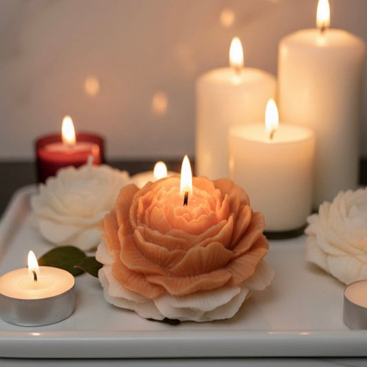 Decorative candles shaped like flowers on a marble surface
